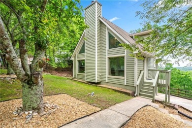 This stunning home offers privacy and views of Lake Arrowhead on The Highlands Course at Lake Arrowhead in Georgia - for sale on GolfHomes.com, golf home, golf lot