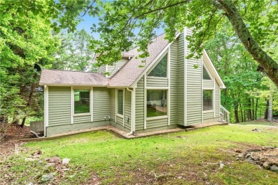This stunning home offers privacy and views of Lake Arrowhead on The Highlands Course at Lake Arrowhead in Georgia - for sale on GolfHomes.com, golf home, golf lot