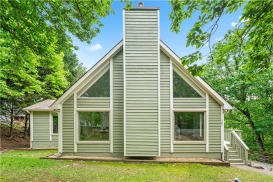 This stunning home offers privacy and views of Lake Arrowhead on The Highlands Course at Lake Arrowhead in Georgia - for sale on GolfHomes.com, golf home, golf lot