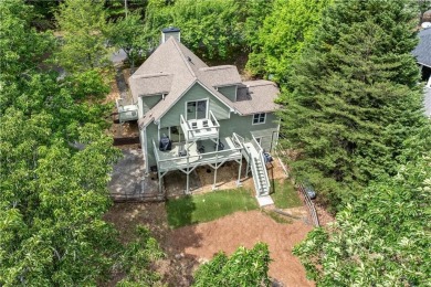 This stunning home offers privacy and views of Lake Arrowhead on The Highlands Course at Lake Arrowhead in Georgia - for sale on GolfHomes.com, golf home, golf lot
