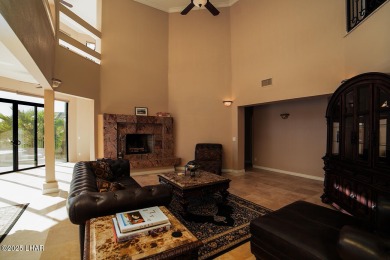 Nestled on the 4th fairway, this stunning 5,577 sq. ft. estate on London Bridge Golf Course in Arizona - for sale on GolfHomes.com, golf home, golf lot