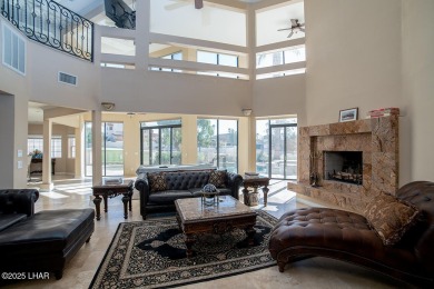 Nestled on the 4th fairway, this stunning 5,577 sq. ft. estate on London Bridge Golf Course in Arizona - for sale on GolfHomes.com, golf home, golf lot