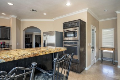 Nestled on the 4th fairway, this stunning 5,577 sq. ft. estate on London Bridge Golf Course in Arizona - for sale on GolfHomes.com, golf home, golf lot