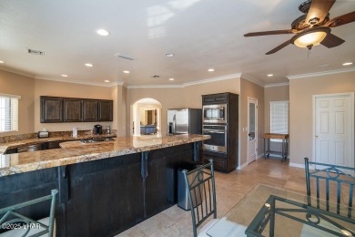 Nestled on the 4th fairway, this stunning 5,577 sq. ft. estate on London Bridge Golf Course in Arizona - for sale on GolfHomes.com, golf home, golf lot