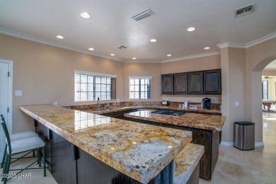 Nestled on the 4th fairway, this stunning 5,577 sq. ft. estate on London Bridge Golf Course in Arizona - for sale on GolfHomes.com, golf home, golf lot