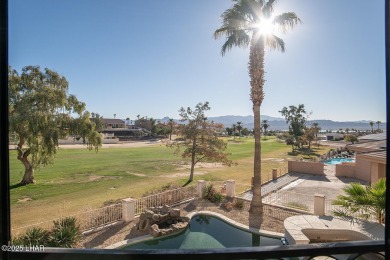 Nestled on the 4th fairway, this stunning 5,577 sq. ft. estate on London Bridge Golf Course in Arizona - for sale on GolfHomes.com, golf home, golf lot