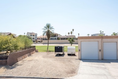 Nestled on the 4th fairway, this stunning 5,577 sq. ft. estate on London Bridge Golf Course in Arizona - for sale on GolfHomes.com, golf home, golf lot