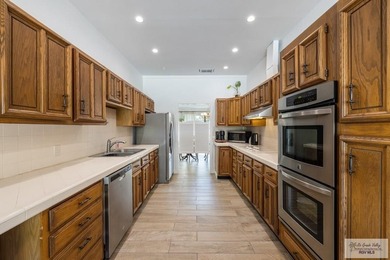 Beautiful 4-bedroom, 5-bath home on a resaca lot in Rancho on Rancho Viejo Resort and Country Club in Texas - for sale on GolfHomes.com, golf home, golf lot