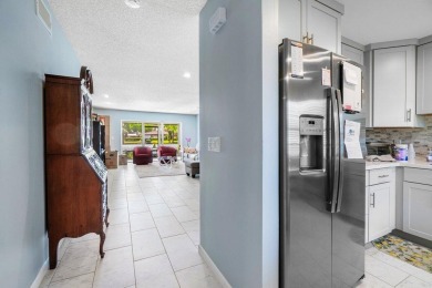 FULLY UPGRADED WATERFRONT FIRST FLOOR UNIT IN SOUGHT AFTER on Boca Lago Golf and Country Club in Florida - for sale on GolfHomes.com, golf home, golf lot