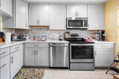 FULLY UPGRADED WATERFRONT FIRST FLOOR UNIT IN SOUGHT AFTER on Boca Lago Golf and Country Club in Florida - for sale on GolfHomes.com, golf home, golf lot