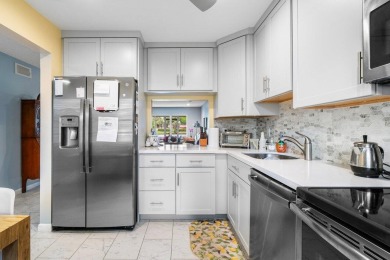 FULLY UPGRADED WATERFRONT FIRST FLOOR UNIT IN SOUGHT AFTER on Boca Lago Golf and Country Club in Florida - for sale on GolfHomes.com, golf home, golf lot