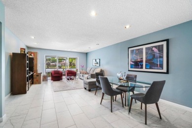 FULLY UPGRADED WATERFRONT FIRST FLOOR UNIT IN SOUGHT AFTER on Boca Lago Golf and Country Club in Florida - for sale on GolfHomes.com, golf home, golf lot