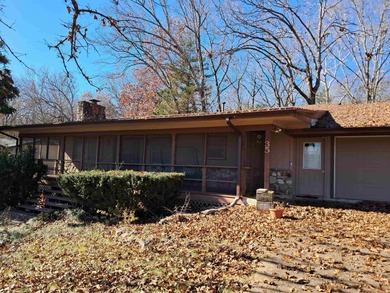 LARGE, SINGLE LEVEL HOME, SMALL PRICE!! This almost 2000 sq. ft on Cherokee Village North Course in Arkansas - for sale on GolfHomes.com, golf home, golf lot