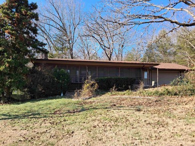 LARGE, SINGLE LEVEL HOME, SMALL PRICE!! This almost 2000 sq. ft on Cherokee Village North Course in Arkansas - for sale on GolfHomes.com, golf home, golf lot
