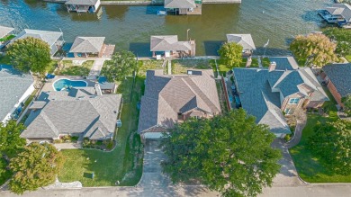 This is a wonderful lakefront home with a boat dock for one boat on Harbor Lakes Golf Club in Texas - for sale on GolfHomes.com, golf home, golf lot
