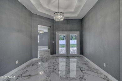This newly remodeled 3-bedroom, 3-bathroom home in the desirable on The Grand Club - Pine Lakes Course in Florida - for sale on GolfHomes.com, golf home, golf lot