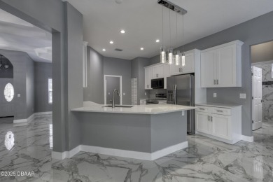 This newly remodeled 3-bedroom, 3-bathroom home in the desirable on The Grand Club - Pine Lakes Course in Florida - for sale on GolfHomes.com, golf home, golf lot