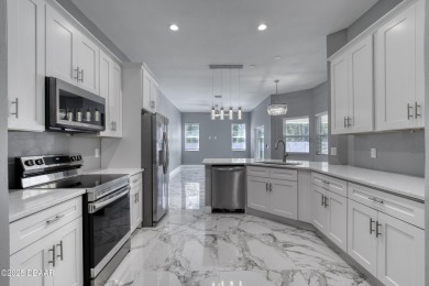 This newly remodeled 3-bedroom, 3-bathroom home in the desirable on The Grand Club - Pine Lakes Course in Florida - for sale on GolfHomes.com, golf home, golf lot