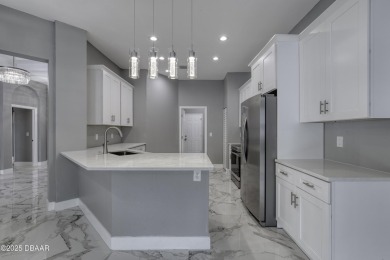 This newly remodeled 3-bedroom, 3-bathroom home in the desirable on The Grand Club - Pine Lakes Course in Florida - for sale on GolfHomes.com, golf home, golf lot