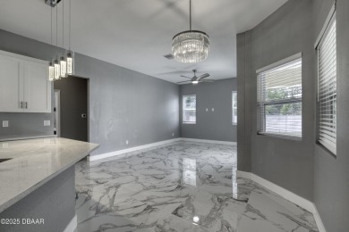 This newly remodeled 3-bedroom, 3-bathroom home in the desirable on The Grand Club - Pine Lakes Course in Florida - for sale on GolfHomes.com, golf home, golf lot