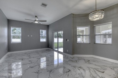 This newly remodeled 3-bedroom, 3-bathroom home in the desirable on The Grand Club - Pine Lakes Course in Florida - for sale on GolfHomes.com, golf home, golf lot