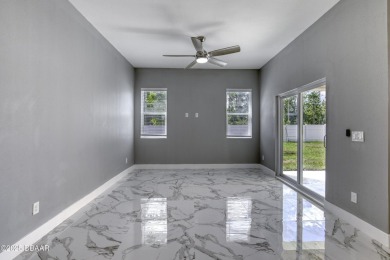 This newly remodeled 3-bedroom, 3-bathroom home in the desirable on The Grand Club - Pine Lakes Course in Florida - for sale on GolfHomes.com, golf home, golf lot