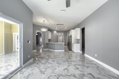 This newly remodeled 3-bedroom, 3-bathroom home in the desirable on The Grand Club - Pine Lakes Course in Florida - for sale on GolfHomes.com, golf home, golf lot