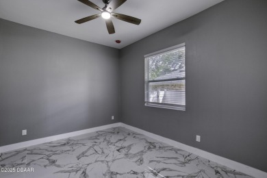 This newly remodeled 3-bedroom, 3-bathroom home in the desirable on The Grand Club - Pine Lakes Course in Florida - for sale on GolfHomes.com, golf home, golf lot