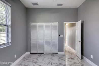This newly remodeled 3-bedroom, 3-bathroom home in the desirable on The Grand Club - Pine Lakes Course in Florida - for sale on GolfHomes.com, golf home, golf lot