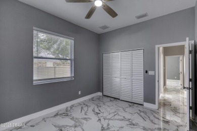 This newly remodeled 3-bedroom, 3-bathroom home in the desirable on The Grand Club - Pine Lakes Course in Florida - for sale on GolfHomes.com, golf home, golf lot