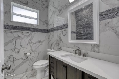 This newly remodeled 3-bedroom, 3-bathroom home in the desirable on The Grand Club - Pine Lakes Course in Florida - for sale on GolfHomes.com, golf home, golf lot