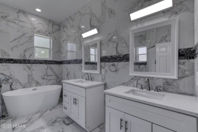 This newly remodeled 3-bedroom, 3-bathroom home in the desirable on The Grand Club - Pine Lakes Course in Florida - for sale on GolfHomes.com, golf home, golf lot
