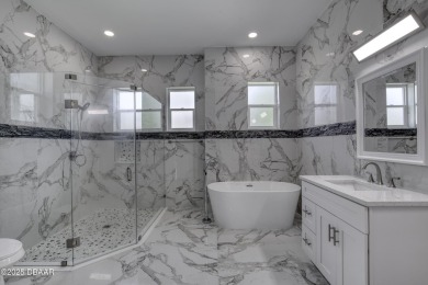This newly remodeled 3-bedroom, 3-bathroom home in the desirable on The Grand Club - Pine Lakes Course in Florida - for sale on GolfHomes.com, golf home, golf lot