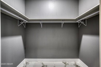 This newly remodeled 3-bedroom, 3-bathroom home in the desirable on The Grand Club - Pine Lakes Course in Florida - for sale on GolfHomes.com, golf home, golf lot