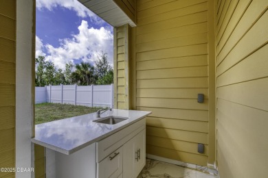 This newly remodeled 3-bedroom, 3-bathroom home in the desirable on The Grand Club - Pine Lakes Course in Florida - for sale on GolfHomes.com, golf home, golf lot