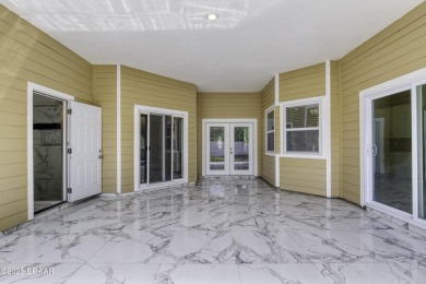 This newly remodeled 3-bedroom, 3-bathroom home in the desirable on The Grand Club - Pine Lakes Course in Florida - for sale on GolfHomes.com, golf home, golf lot