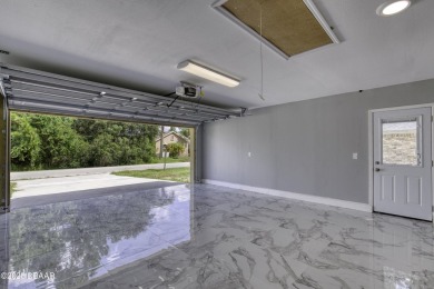 This newly remodeled 3-bedroom, 3-bathroom home in the desirable on The Grand Club - Pine Lakes Course in Florida - for sale on GolfHomes.com, golf home, golf lot