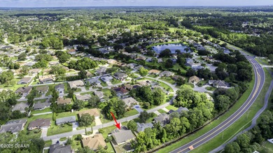 This newly remodeled 3-bedroom, 3-bathroom home in the desirable on The Grand Club - Pine Lakes Course in Florida - for sale on GolfHomes.com, golf home, golf lot