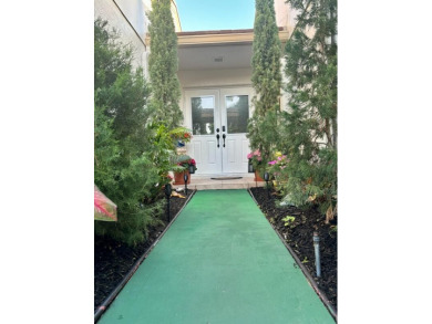 Professionally landscaped and exquisitely updated 3-bedroom 2- on Martin Downs Country Club in Florida - for sale on GolfHomes.com, golf home, golf lot