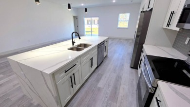This home has the perfect blend of luxury and comfort, open on Rotonda Golf and Country Club - Long Marsh  in Florida - for sale on GolfHomes.com, golf home, golf lot