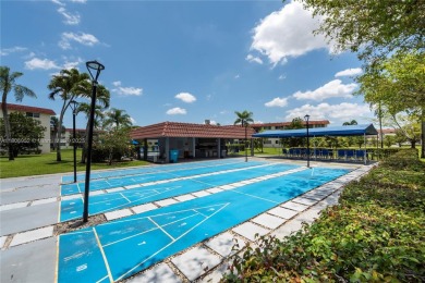 Charming one-bedroom, one and a half-bath condo in Hollybrook, a on Hollybrook Golf and Tennis Club  in Florida - for sale on GolfHomes.com, golf home, golf lot