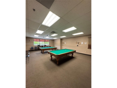 Charming one-bedroom, one and a half-bath condo in Hollybrook, a on Hollybrook Golf and Tennis Club  in Florida - for sale on GolfHomes.com, golf home, golf lot