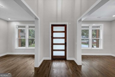 Step into flawless modern luxury at this brand-new custom-built on East Lake Golf Club in Georgia - for sale on GolfHomes.com, golf home, golf lot