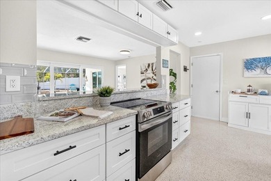 Waterfront living at its finest on highly desirable Vina Del Mar on Isla Del Sol Yacht and Country Club in Florida - for sale on GolfHomes.com, golf home, golf lot