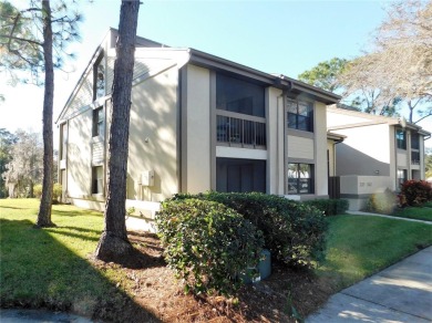 First floor end unit condo located in the Woodlake Run area of on East Lake Woodlands Country Club in Florida - for sale on GolfHomes.com, golf home, golf lot