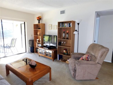First floor end unit condo located in the Woodlake Run area of on East Lake Woodlands Country Club in Florida - for sale on GolfHomes.com, golf home, golf lot