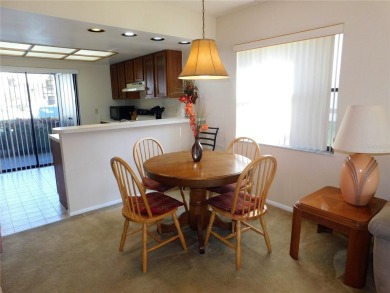First floor end unit condo located in the Woodlake Run area of on East Lake Woodlands Country Club in Florida - for sale on GolfHomes.com, golf home, golf lot