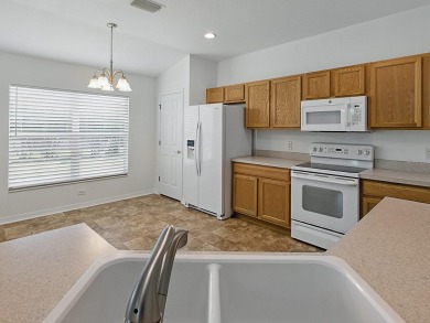 One or more photo(s) has been virtually staged. GREAT PRICE on on Eagle Ridge At Spruce Creek Country Club in Florida - for sale on GolfHomes.com, golf home, golf lot