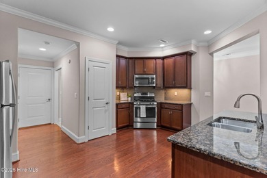 Experience refined coastal living in this beautifully designed on Cape Fear National At Brunswick Forest in North Carolina - for sale on GolfHomes.com, golf home, golf lot
