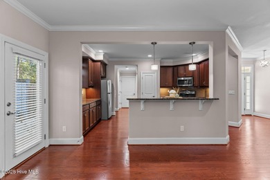 Experience refined coastal living in this beautifully designed on Cape Fear National At Brunswick Forest in North Carolina - for sale on GolfHomes.com, golf home, golf lot